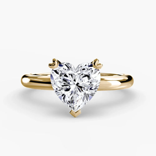 The Kaelis heart shaped diamond solitaire engagement ring in yellow gold