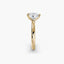 Profile view of The Kaelis showing heart cut diamond in three-prong solitaire setting