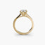 Gold ring with a diamond on a white background
