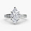 Diamond ring with a marquise-shaped center stone on a white background