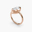 The Novara marquise bezel ring displaying elongated boat-shaped diamond and sleek setting profile in rose gold solitaire setting