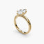 Side view of The Caelora showing marquise diamond with protected pointed ends in double prong setting in yellow gold