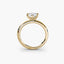 Side view of The Caelora showing marquise diamond with protected pointed ends in double prong yellow gold setting
