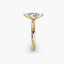 Profile view of The Caelora showing marquise diamond with protected pointed ends in double prong yellow gold setting