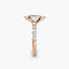 Rose gold ring with a diamond on a white background