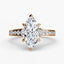 Diamond ring with a marquise-shaped center stone on a white background