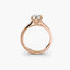 Rose gold ring with a diamond on a white background