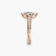 Rose gold ring with diamond accents on a white background