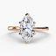 Rose gold solitaire ring with a marquise-shaped diamond 