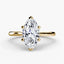 Solitaire gold ring with a marquise-shaped diamond 