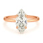 A marquise solitaire lab-grown diamond engagement ring with a rose gold band.
