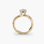 Gold ring with a diamond on a white background