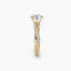 Gold ring with a diamond on a white background
