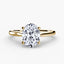 Solitaire gold ring with a large oval-cut diamond on a white background