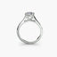 Platinum solitaire ring with a diamond on a white background