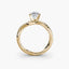 Gold ring with a diamond on a white background