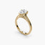 Solitaire gold ring with a pear-shaped diamond on a white background