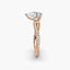 Rose gold ring with a diamond on a white background