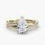 Gold ring with a pear-shaped diamond twisted pave shank on a white background.