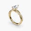 Gold ring with a diamond on a white background