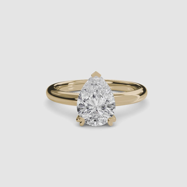 360-degree rotation view the  Zevara pear shaped diamond double prong solitaire engagement ring in yellow gold