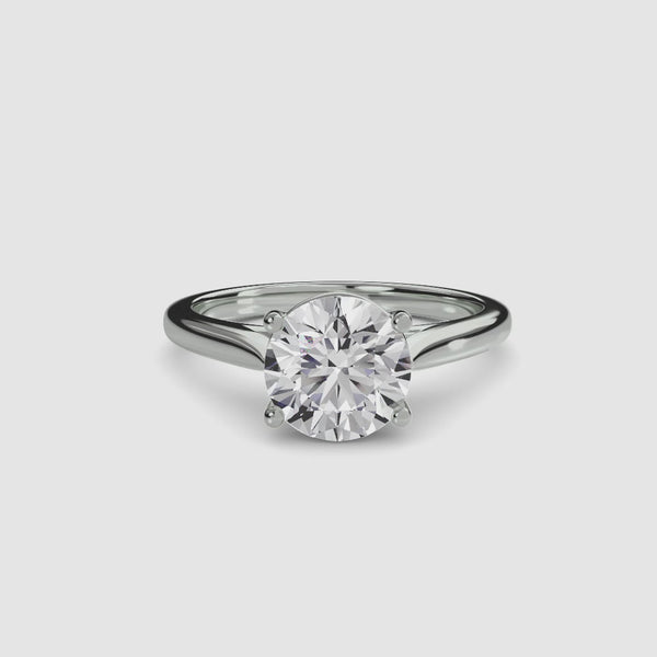 White Gold solitaire ring with a round diamond brilliant cut on a white background