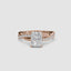 Rose gold ring with a radiant cut diamond twisted pave shank on a white background