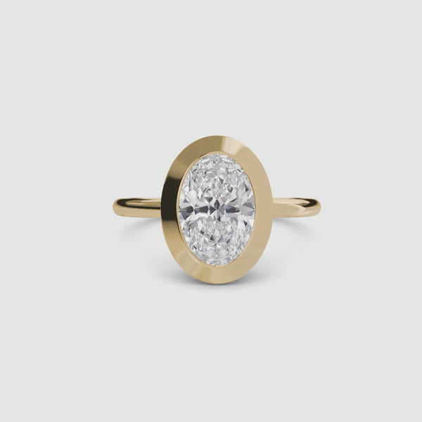 Oval bezel diamond ring solitaire yellow gold setting