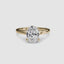 Solitaire gold ring with a large oval-cut diamond on a white background