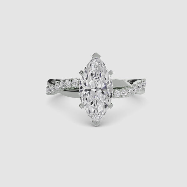 White Gold ring with a marquise-shaped diamond twisted pave band on a white background