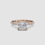 Rose gold ring with a large Asscher-cut diamond and smaller diamonds on the band marquise and round on a white background
