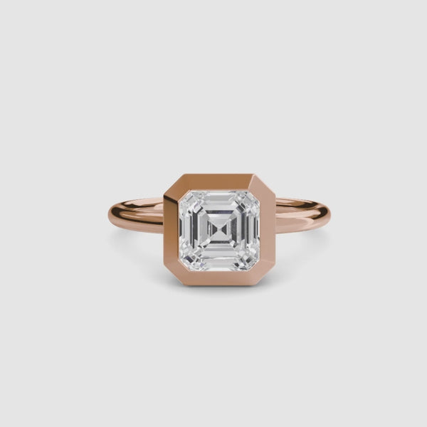 360-degree rotation view of The Lucen asscher cut diamond bezel engagement ring in rose gold showing all angles