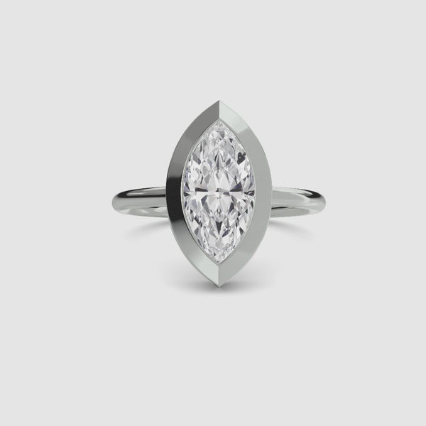 360-degree rotation view of The Novara marquise cut diamond bezel engagement ring in white gold showing all angles