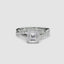 White Gold ring with a large Asscher diamond and smaller diamonds on the twisted band against a white background