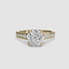 Gold ring with a large round diamond and smaller diamonds on the band against a white background