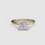 Gold ring with a large princess-cut diamond on a white background