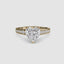 Gold ring with a heart-shaped diamond and round pave on the shank on a white background