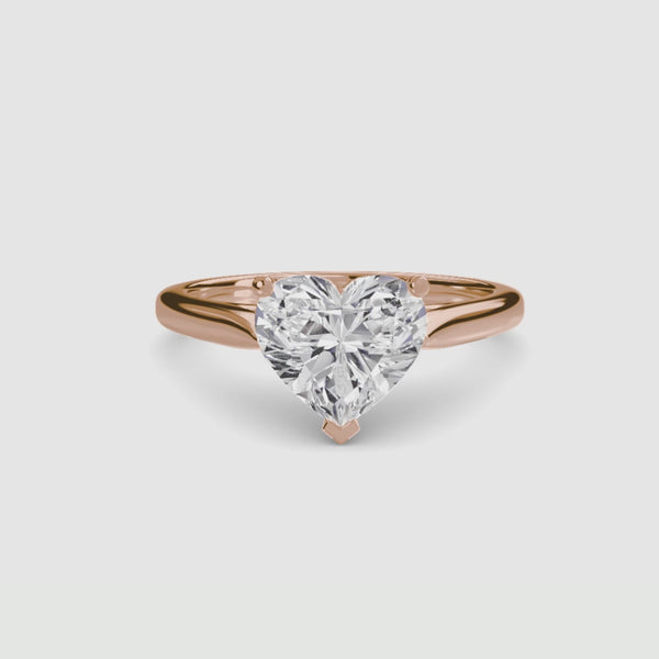 Rose gold solitaire ring with a heart-shaped diamond