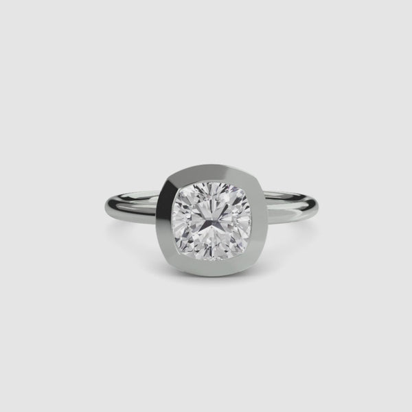 Cushion cur bezel set ring in white gold solitaire setting