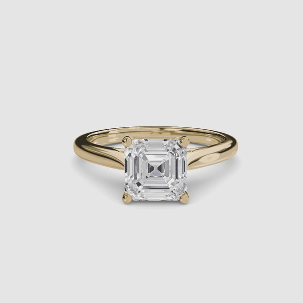 Solitaire gold ring with a square asscher-cut diamond 