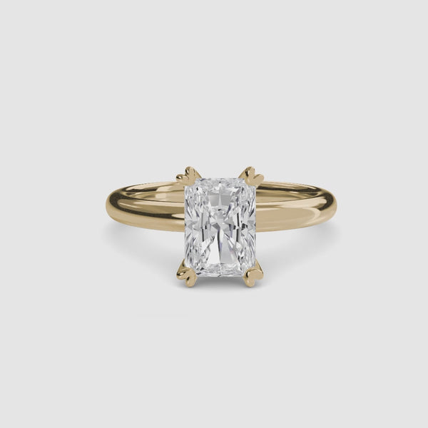 360-degree rotation the Aurien radiant cut diamond double prong solitaire engagement ring in yellow gold