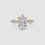 Rose gold ring with a marquise-cut diamond on the center and side stones marquise round on a white background