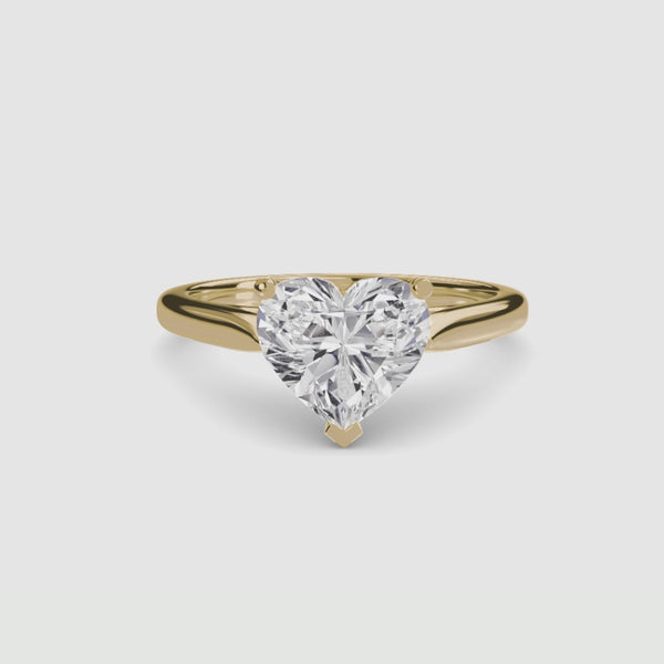 Solitaire gold ring with a heart-shaped diamond