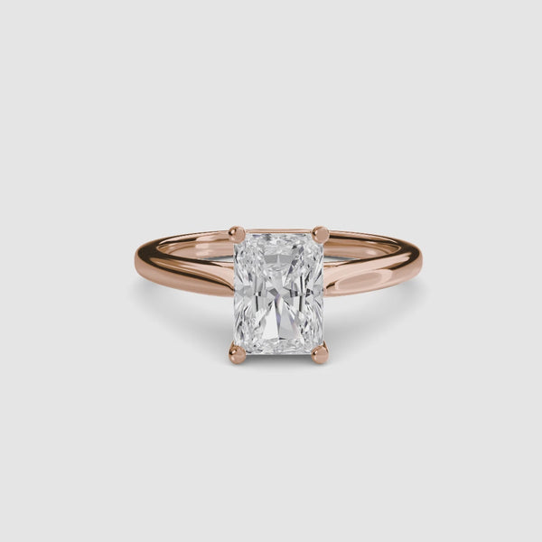 Rose gold solitaire ring with a radiant cut diamond