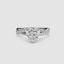 White gold ring with a heart-shaped diamond twisted pave band on a white background