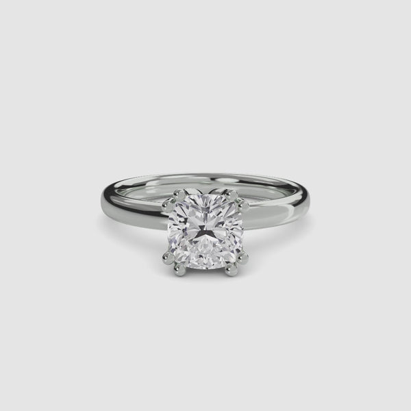 360 video view of the Solaris cushion-cut diamond solitaire engagement ring in 14k white gold, featuring a large cushion-cut diamond secured by eight ball-tipped prongs in a floral basket setting with a plain polished tapered band.