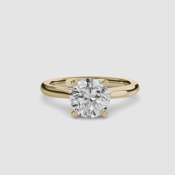 360-rotation-view-the Solvane round brilliant cut diamond classic solitaire engagement ring in yellow gold