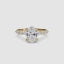 Gold ring with a large oval cut diamond and smaller marquise round diamonds on the sides of the band against a white background