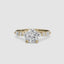 Gold ring with a large round diamond and smaller diamonds on the band against a white background