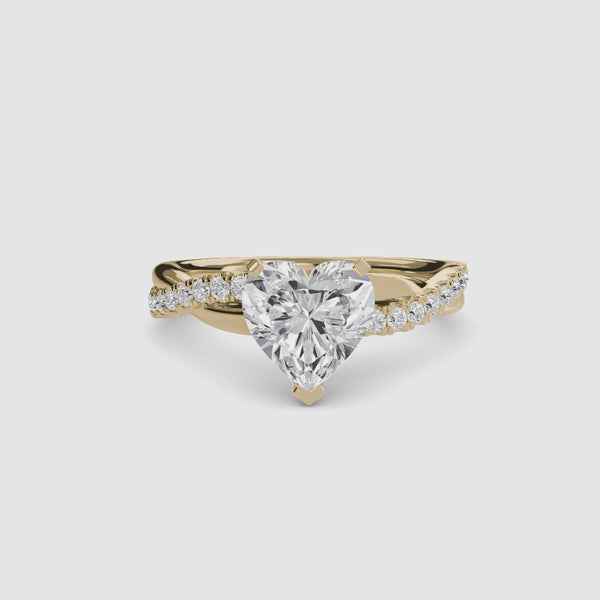 The Lumina heart shaped diamond engagement ring with twisted pave band in yellow gold